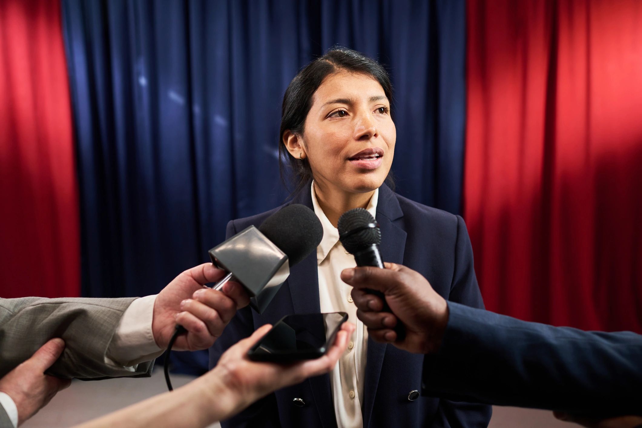 Politician answering questions from reporters