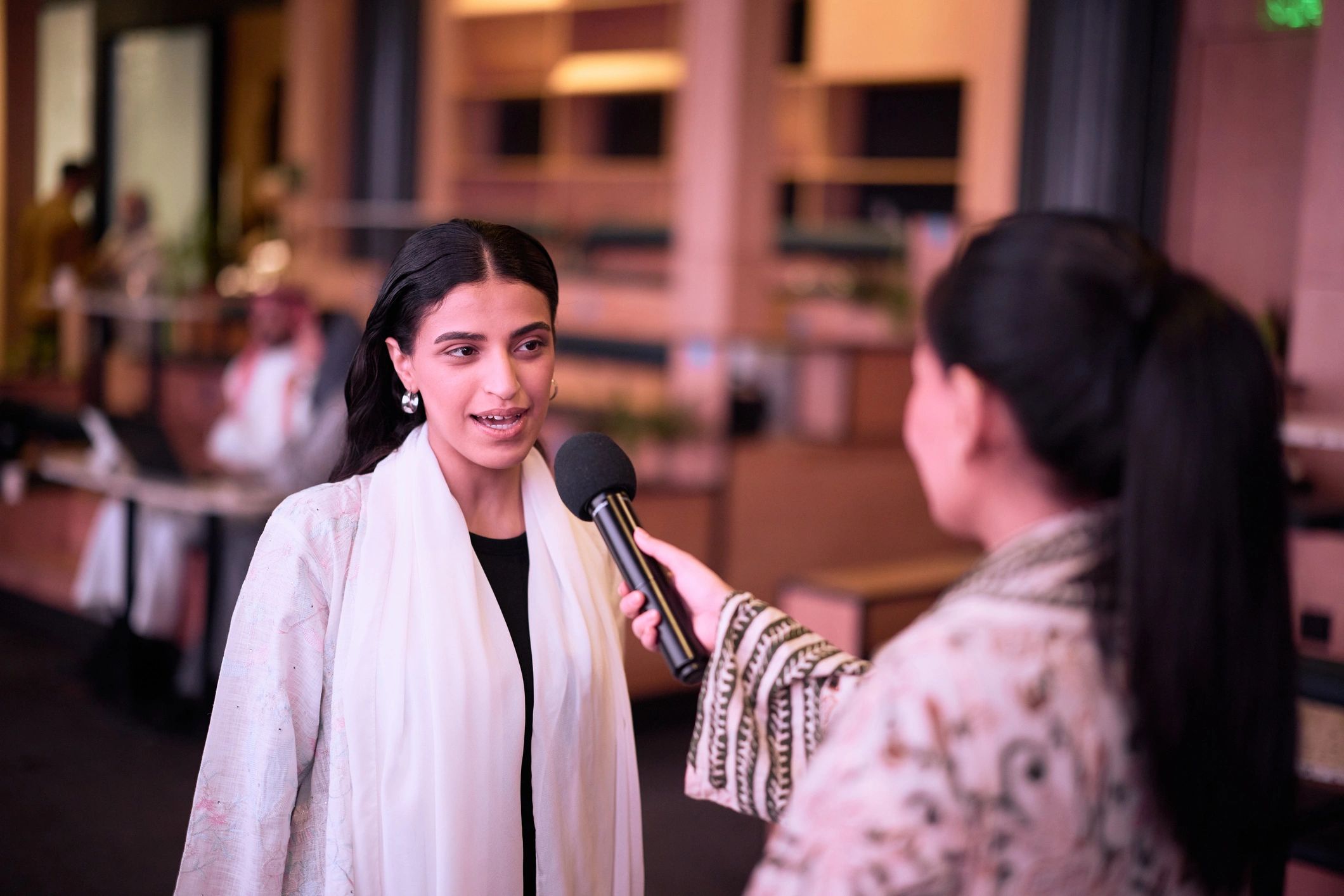 Journalist interviewing a guest at a media event