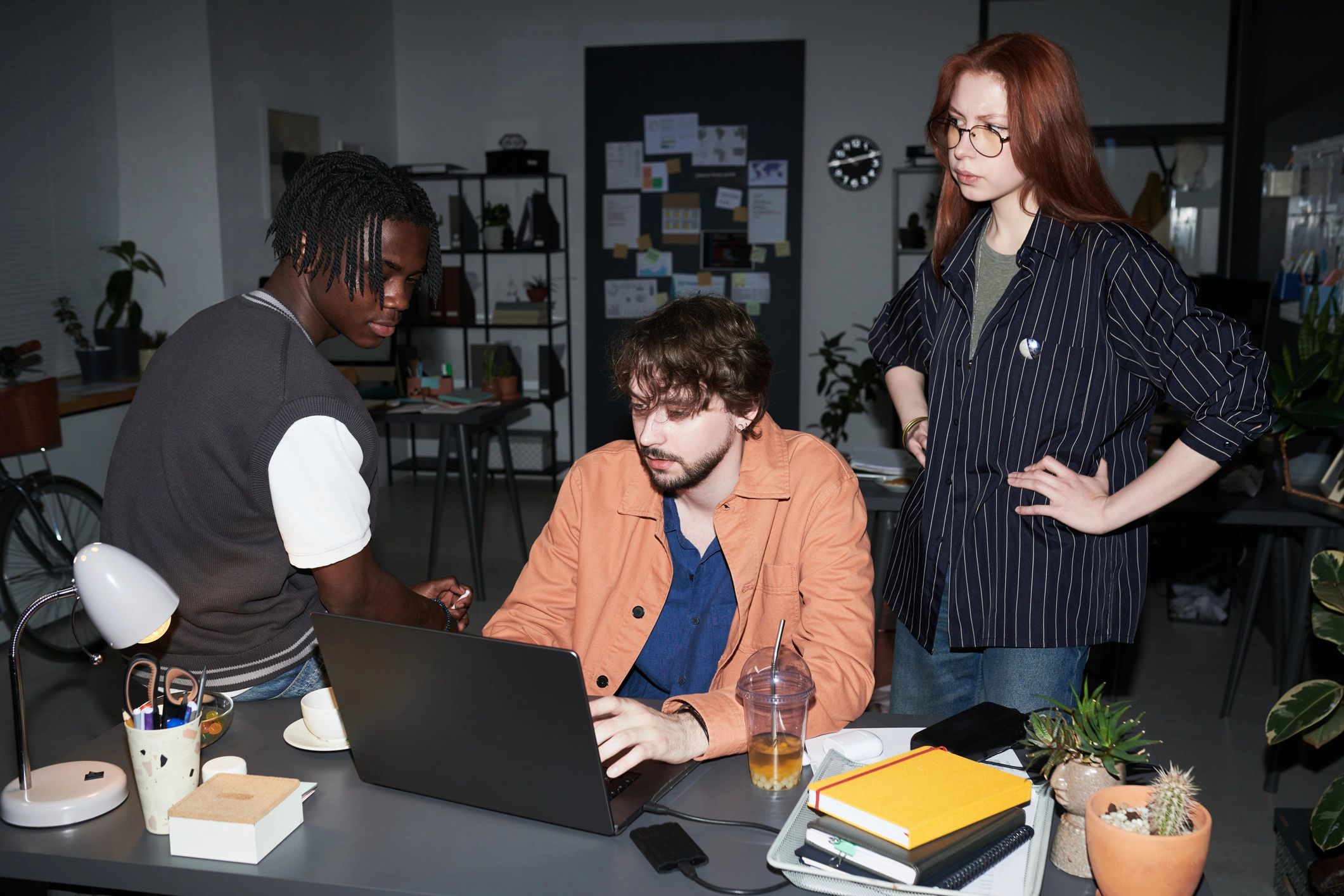 Editorial team collaborating in a newsroom office